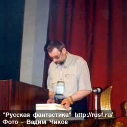 Aleksandr Sidorovich is reading out the diploma of "Interpresscon" award.